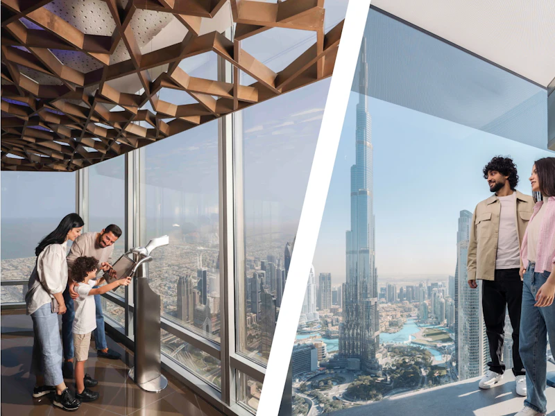 Visitors looking through observatory glass windows toward Burj Khalifa